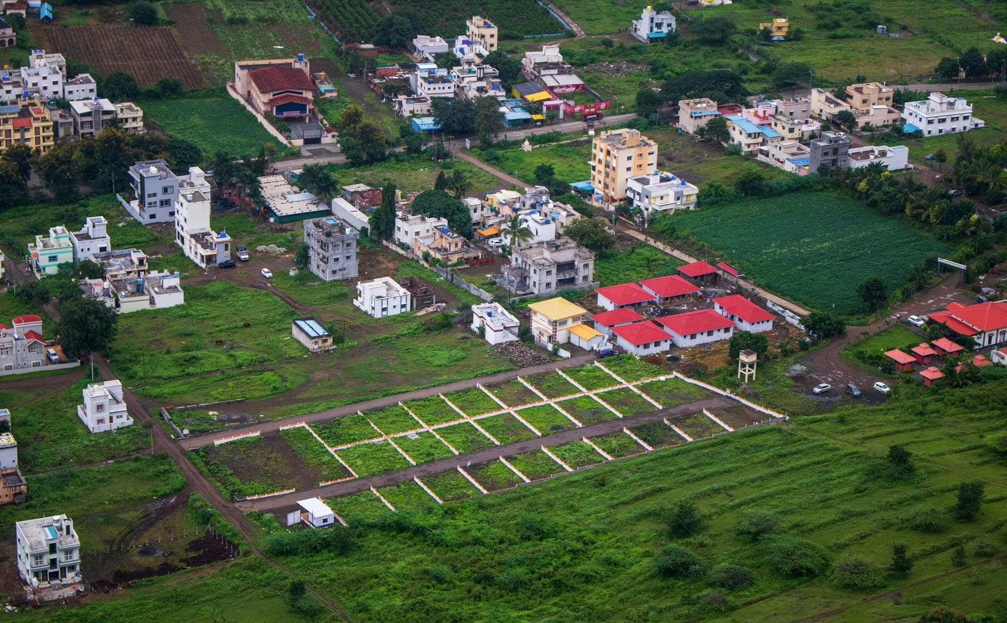 Aerial view of houses and marked residential plots in Junnar, Maharashtra