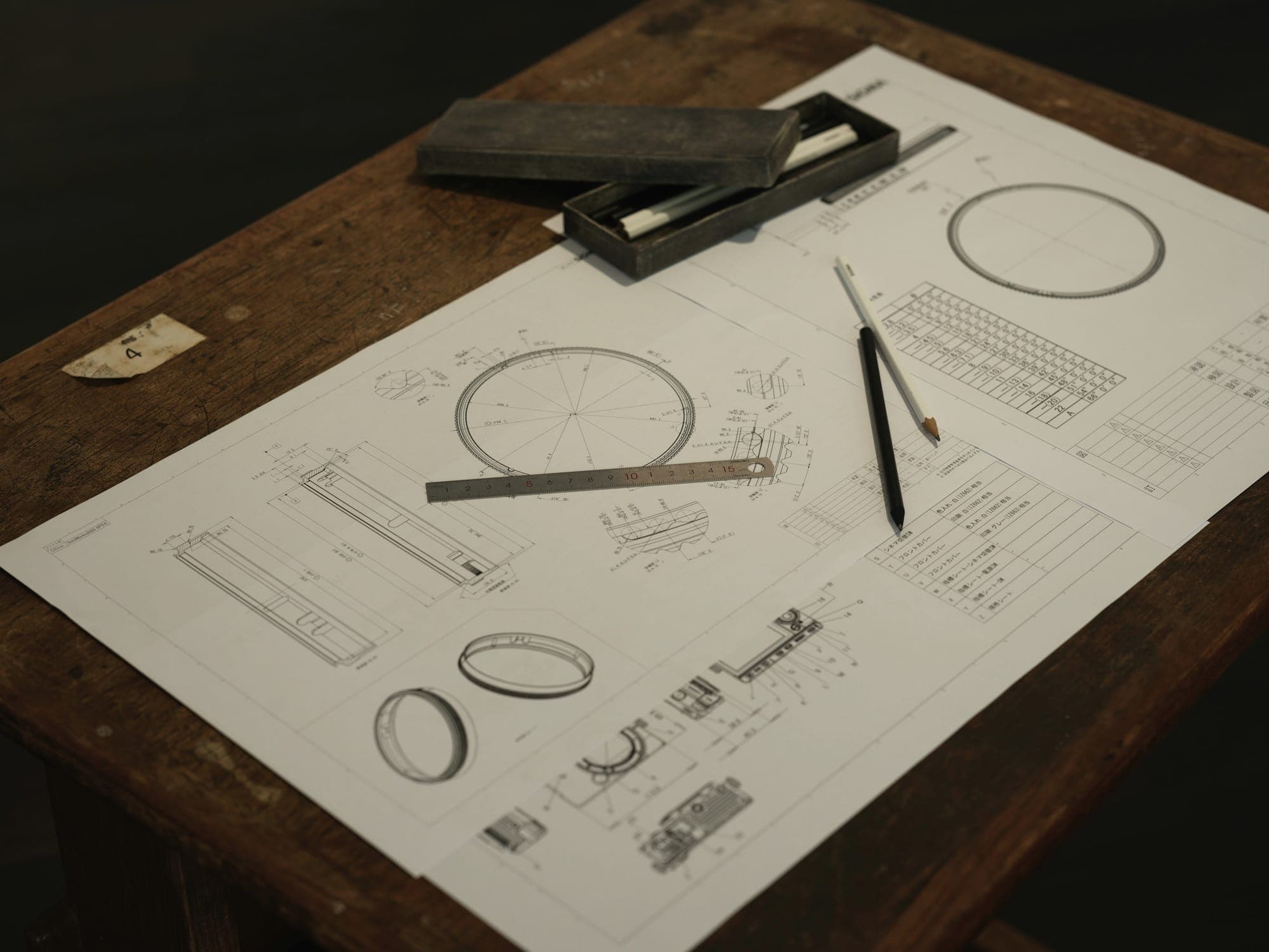 A drawing and drafting tools on a wooden work table
