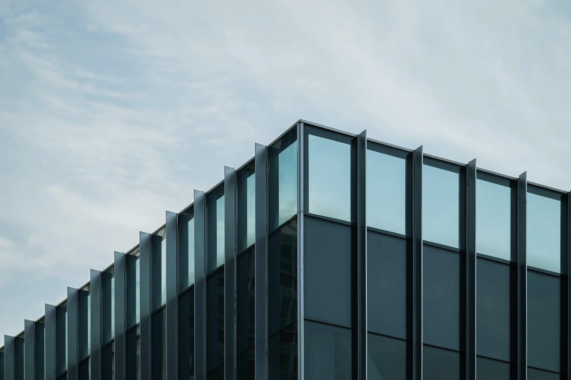 The glass facade of an office building