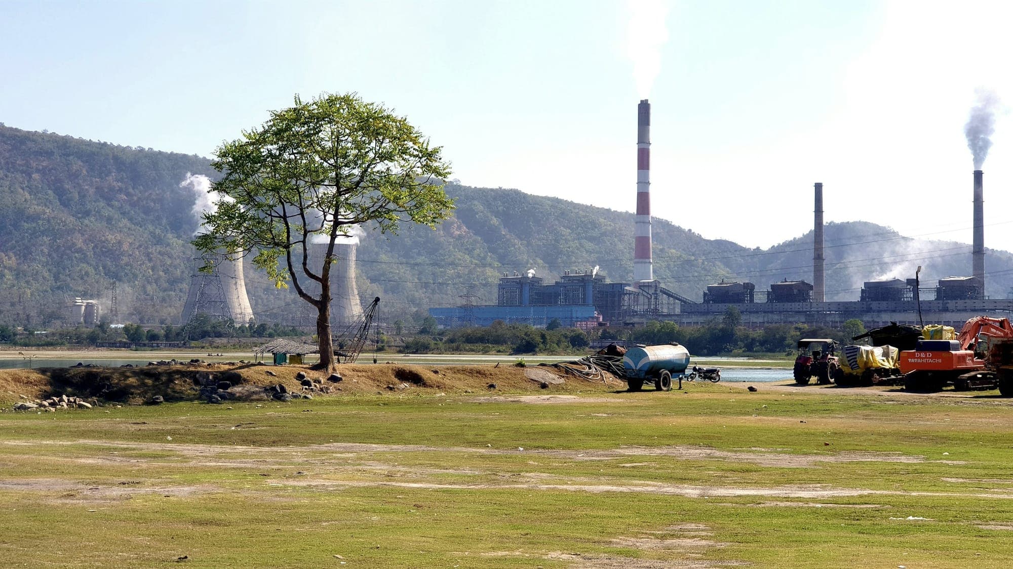 A thermal power station at Sarni, Madhya Pradesh, seen across open ground